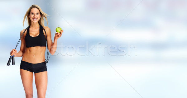 Young fitness woman with apple. Stock photo © Kurhan