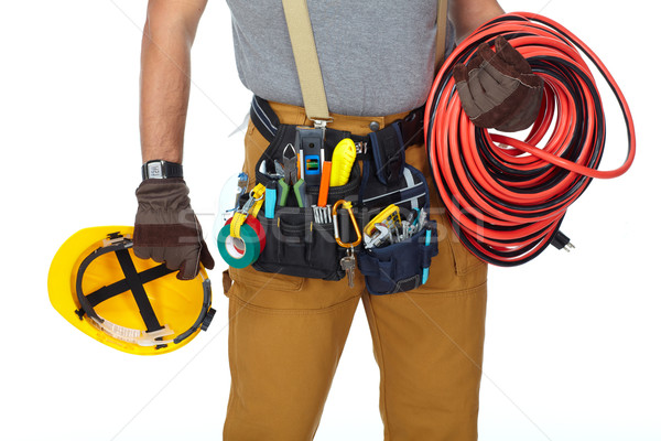 Electrician with construction tools and cable. Stock photo © Kurhan
