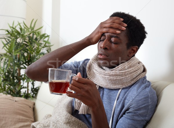 Krank schwarzen Mann junger Mann trinken heißen Stock foto © Kurhan