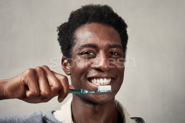 Man with toothbrush. Stock photo © Kurhan