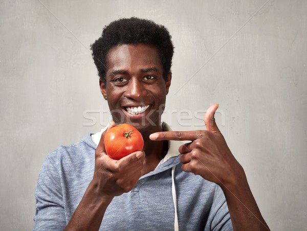 Black man with tomato. Stock photo © Kurhan