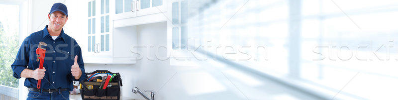 Plumber with wrench. Stock photo © Kurhan