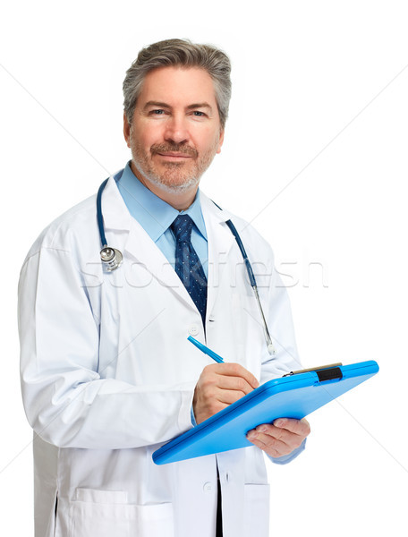 Doctor pharmacist writing on clipboard. Stock photo © Kurhan