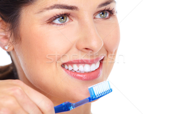 Heureux femme brosse à dents soins dentaires isolé blanche Photo stock © Kurhan