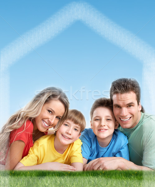 Happy family near new home. Stock photo © Kurhan