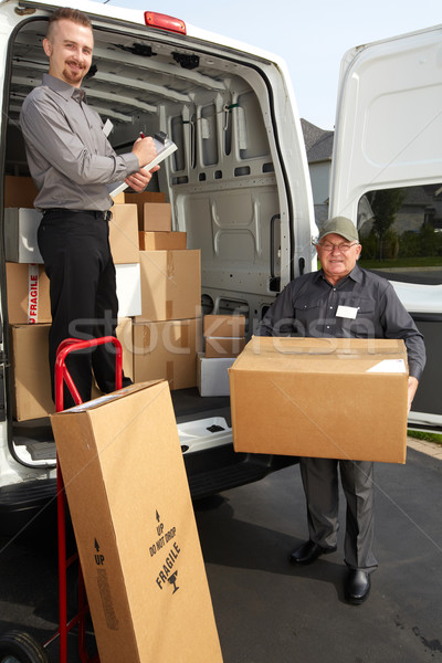Group of delivery man with a parcel. Stock photo © Kurhan