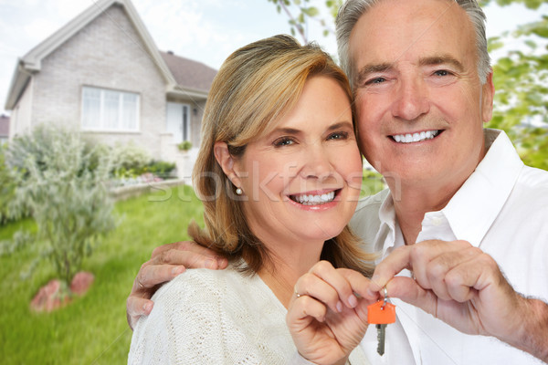 Senior couple with house key. Stock photo © Kurhan