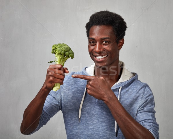 Black man with broccoli Stock photo © Kurhan