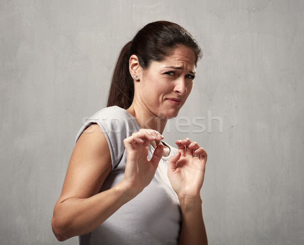 Girl disgusted face expression Stock photo © Kurhan