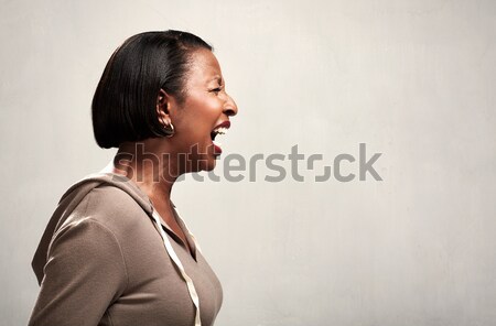 Stock photo: Angry screaming african american woman