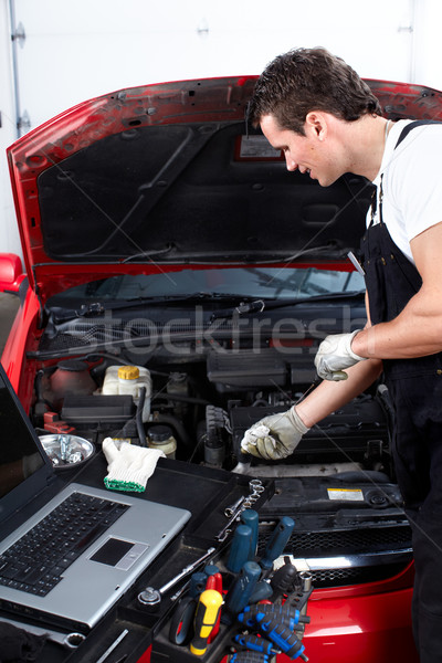 Auto mechanic checking oil. Stock photo © Kurhan