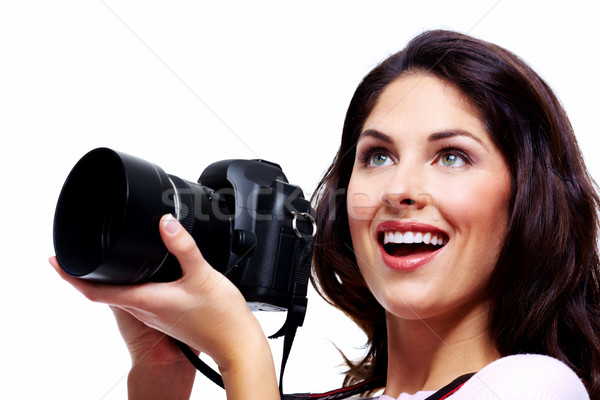 Stock photo: Woman with a photo camera.