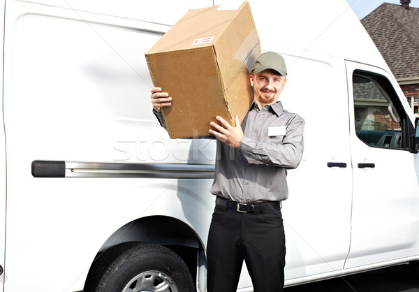 Postman with parcel near delivery truck. Stock photo © Kurhan
