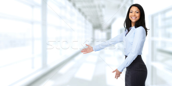 Asian business woman inviting in the office. Stock photo © Kurhan