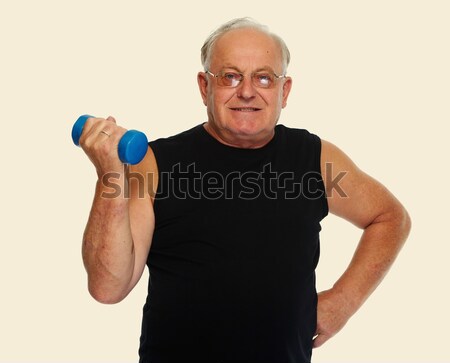 Stock photo: Senior man with dumbbell.