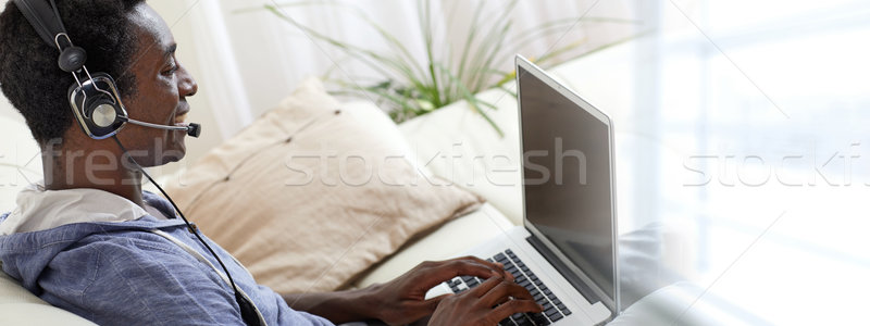 Afro-american man listening music. Stock photo © Kurhan