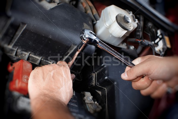 Mechanic working in auto repair garage Stock photo © Kurhan