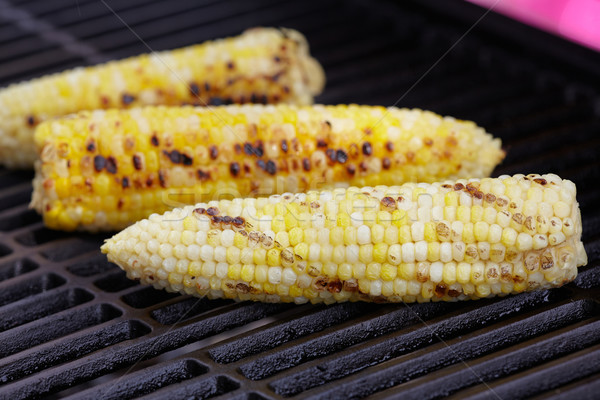 Corn roast on barbecue grille. Stock photo © Kurhan