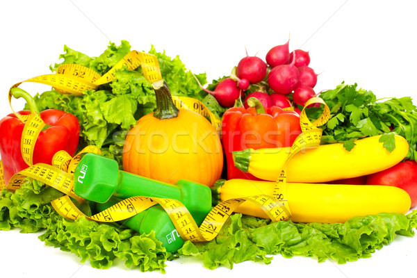 Fresh vegetables and dumbbells. Stock photo © Kurhan