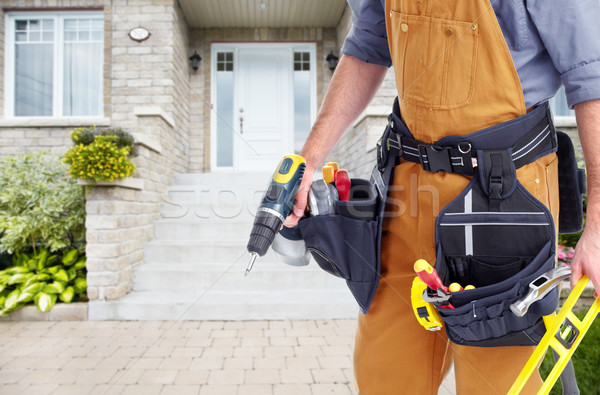 Builder handyman near new house. Stock photo © Kurhan