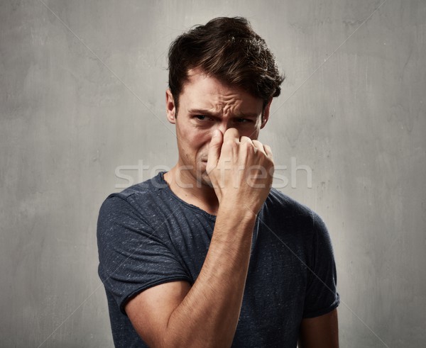 Om tânăr dezgust faţă expresii portret Imagine de stoc © Kurhan