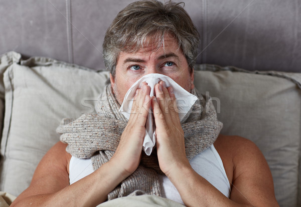 Sick man in bed Stock photo © Kurhan