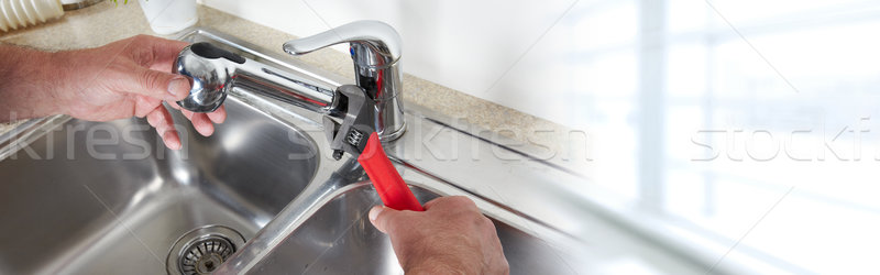 Plumber with wrench. Stock photo © Kurhan