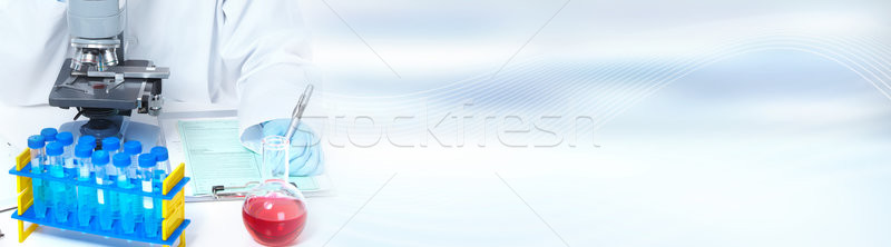 Doctor woman with microscope Stock photo © Kurhan