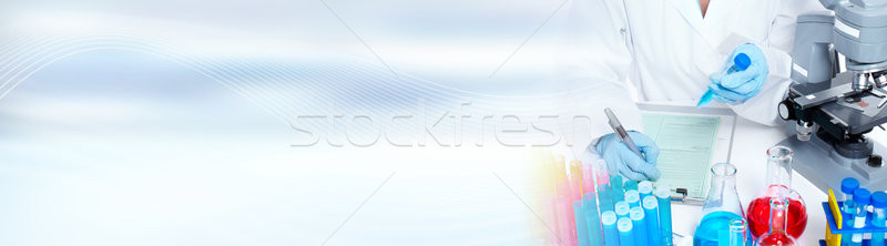 Doctor woman with microscope Stock photo © Kurhan