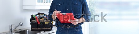 Plumber hands with clipboard. Stock photo © Kurhan