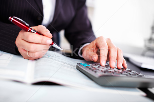 Hands of accountant business woman with calculator. Stock photo © Kurhan