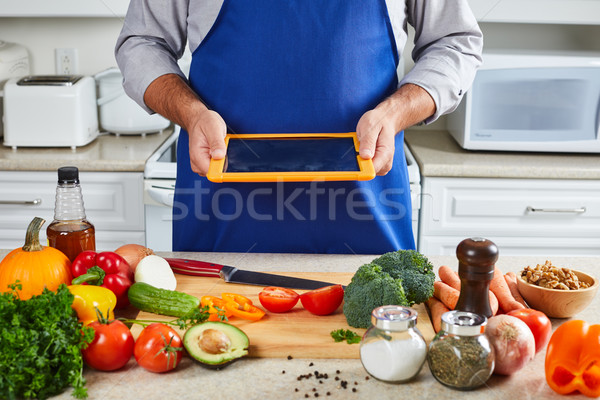 Chef man cooking in the kitchen. Stock photo © Kurhan