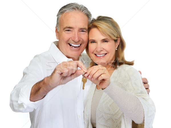 Senior couple with house key. Stock photo © Kurhan