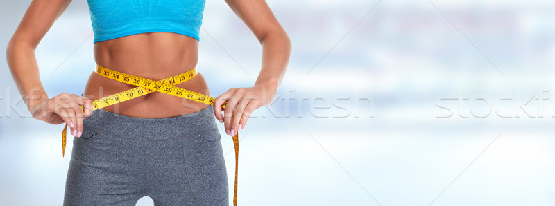 Abdomen mètre à ruban jeune femme ventre perte régime alimentaire Photo stock © Kurhan