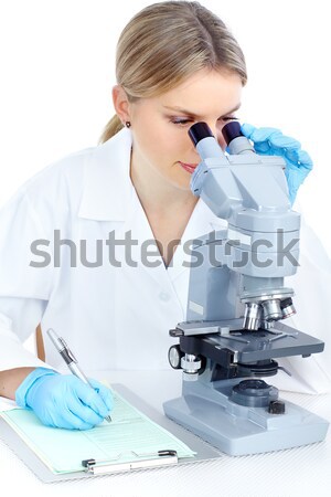 Chinese scientist woman with microscope. Stock photo © Kurhan