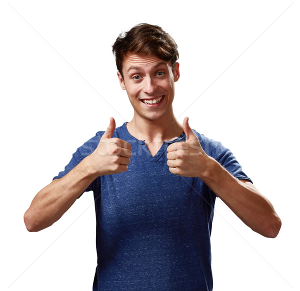 Happy young man with thumbs Stock photo © Kurhan