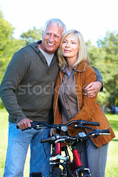 Stock photo: Happy senior couple cyclist.