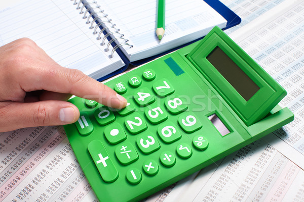 Hand of businessman with calculator. Stock photo © Kurhan