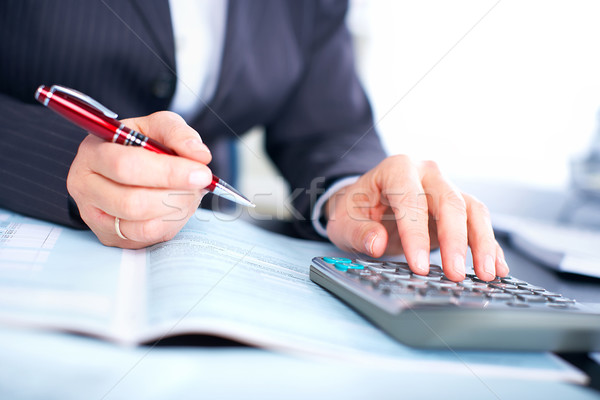 Hands of accountant business woman with calculator. Stock photo © Kurhan