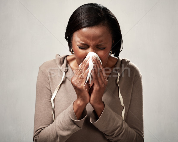 sneezing black woman Stock photo © Kurhan