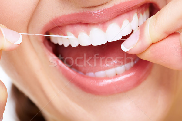 Femeie frumoasa zâmbet dentar clinică faţă Imagine de stoc © Kurhan