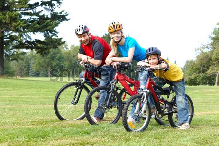 Stockfoto: Gelukkig · gezin · vader · moeder · zoon · paardrijden · park