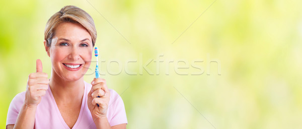 Imagine de stoc: Frumos · senior · femeie · periuţă · de · dinţi · femeie · zambitoare · dentar