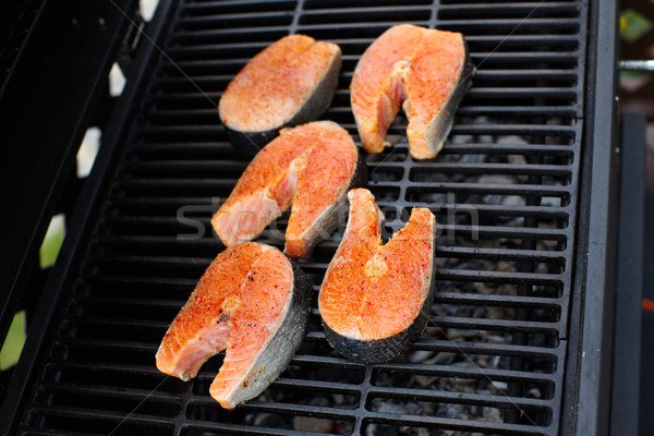 Salmon fish roast on barbecue grill. Stock photo © Kurhan
