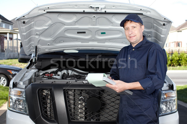 Stock photo: Car mechanic working in auto repair service.