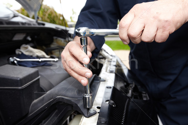 Hands of auto mechanic with wrench. Stock photo © Kurhan