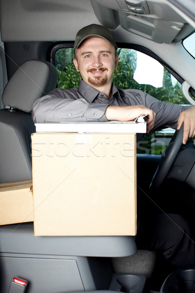 Young delivery man in the car. Stock photo © Kurhan