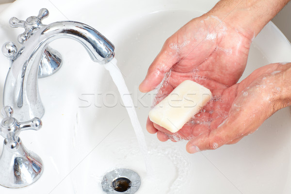 Man washing hands with soap and water. Stock photo © Kurhan