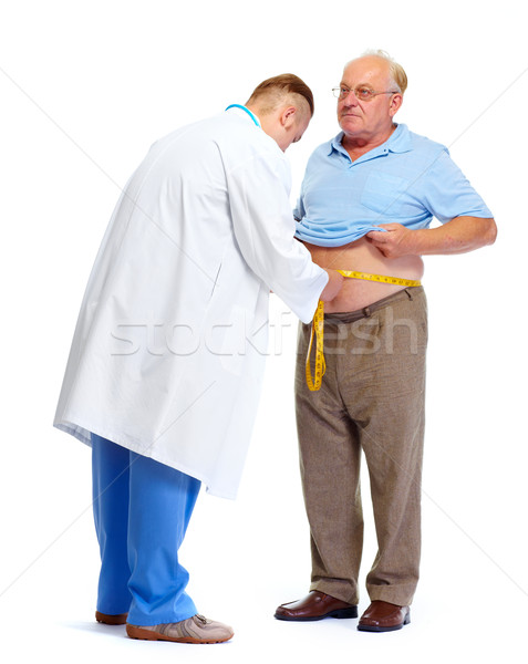Doctor measuring obese man body fat. Stock photo © Kurhan