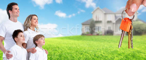 Happy family near new house. Stock photo © Kurhan